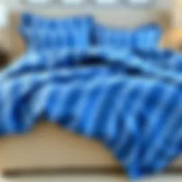 Luxurious blue striped king comforter spread elegantly on a plush bed