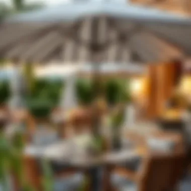 Chic Outdoor Dining Under a Striped Umbrella A beautifully set outdoor dining area with a grey and white striped umbrella
