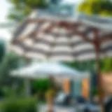 Stylish grey and white striped outdoor umbrella in a garden setting