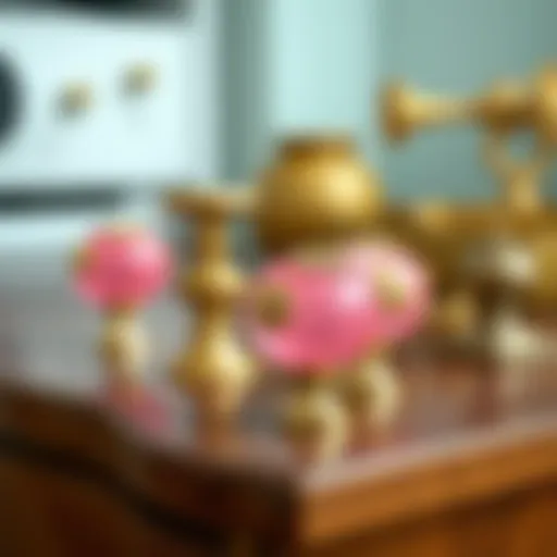 Elegant pink and gold dresser knobs displayed on a wooden dresser