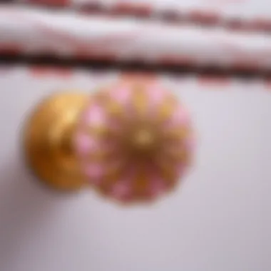 Close-up of a pink and gold knob highlighting its intricate design