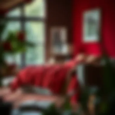 A cozy living space featuring a red coverlet as a focal point.