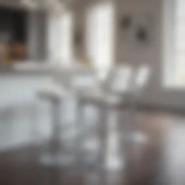 Stylish white chrome stools around a minimalist dining table